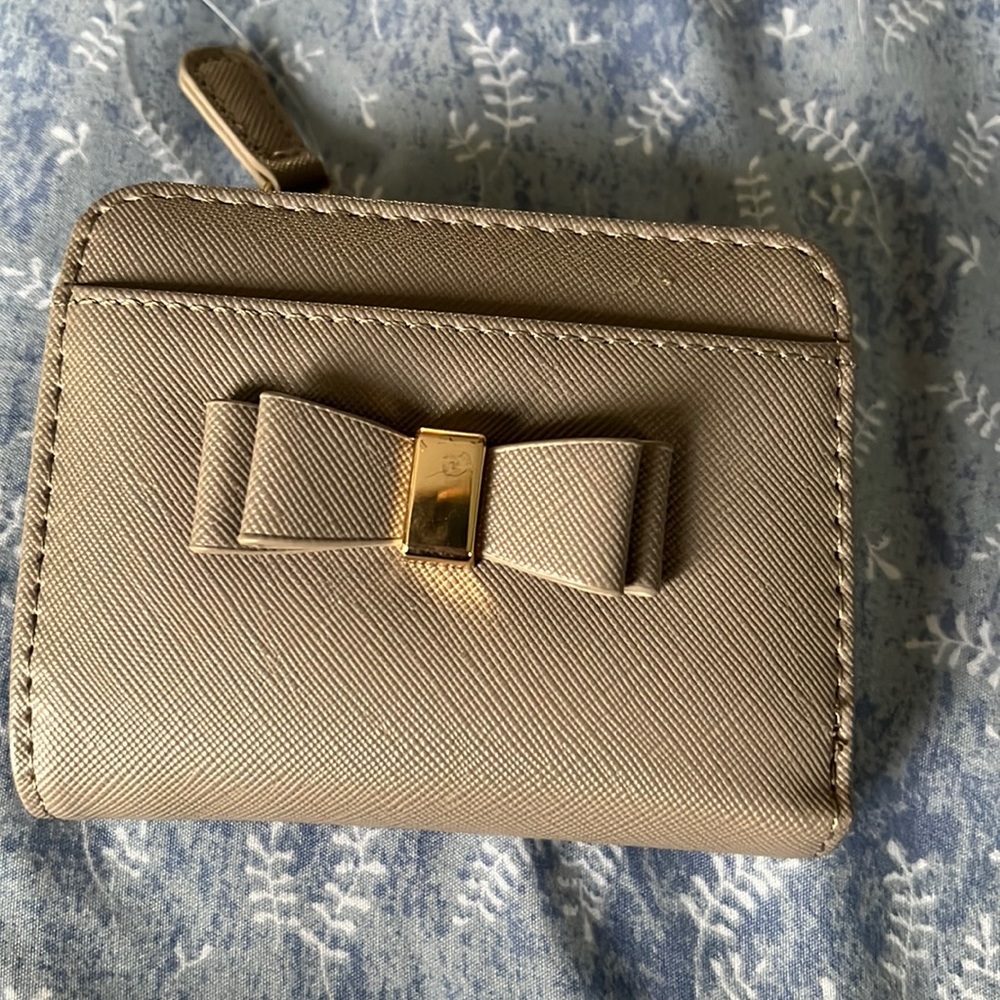 Small billfold wallet new without tags grey color.
